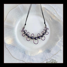 Load image into Gallery viewer, elfin alchemy purple sculptural squiggle necklace with Swarovski pearls handcrafted in Lancashire