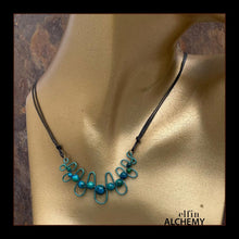 Load image into Gallery viewer, elfin alchemy sculptural squiggle necklace with dark turquoise dyed Magnesite gemstone beads handcrafted in Lancashire
