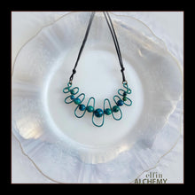 Load image into Gallery viewer, elfin alchemy sculptural squiggle necklace with teal /dark turquoise dyed Magnesite gemstone beads handcrafted in Lancashire
