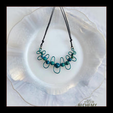 Load image into Gallery viewer, elfin alchemy sculptural squiggle necklace with teal /dark turquoise dyed Magnesite gemstone beads handcrafted in Lancashire