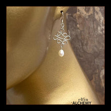 Load image into Gallery viewer, elfin alchemy sterling silver and white sculptural Celtic style freshwater pearl earrings inspired by the magical art of our ancient ancestors, handmade in Lancashire, England
