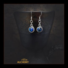 Load image into Gallery viewer, elfin alchemy stunning sculptural spiral sterling silver earrings with blue-purple Swarovski crystals, a design inspired by the magical art of our ancient ancestors