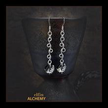 Load image into Gallery viewer, elfin alchemy sterling silver sculptural vine scroll earrings with grey-black front and green back colour Swarovski crystal hearts, inspired by the magical art of our ancient ancestors, handmade in Lancashire, England