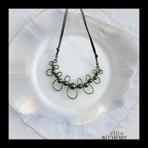 elfin alchemy emerald, verdigris and moss greens sculptural squiggle necklace with Swarovski pearls handcrafted in Lancashire