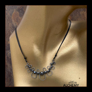 elfin alchemy sculptural squiggle necklace with metallic grey Hematine gemstone beads handcrafted in Lancashire
