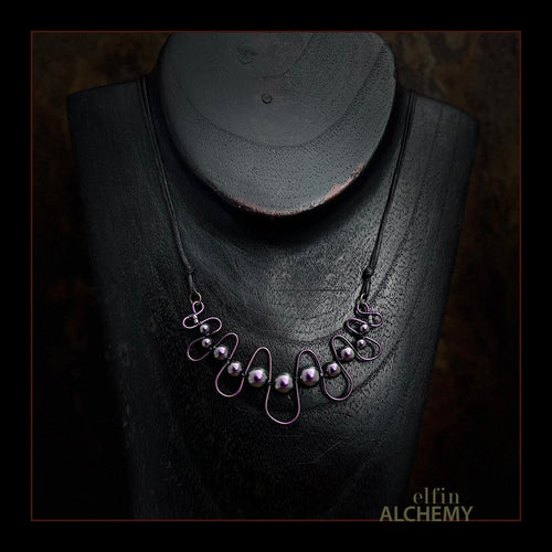 elfin alchemy purple sculptural squiggle necklace with Swarovski pearls handcrafted in Lancashire