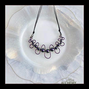 elfin alchemy purple sculptural squiggle necklace with Swarovski pearls handcrafted in Lancashire
