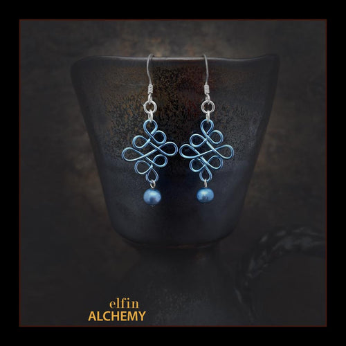 elfin alchemy blue sculptural Celtic style freshwater pearl earrings inspired by the magical art of our ancient ancestors, handmade in Lancashire, England