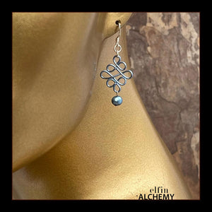 elfin alchemy pale blue sculptural Celtic style freshwater pearl earrings inspired by the magical art of our ancient ancestors, handmade in Lancashire, England