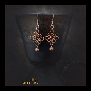 elfin alchemy copper colour sculptural Celtic style freshwater pearl earrings inspired by the magical art of our ancient ancestors, handmade in Lancashire, England