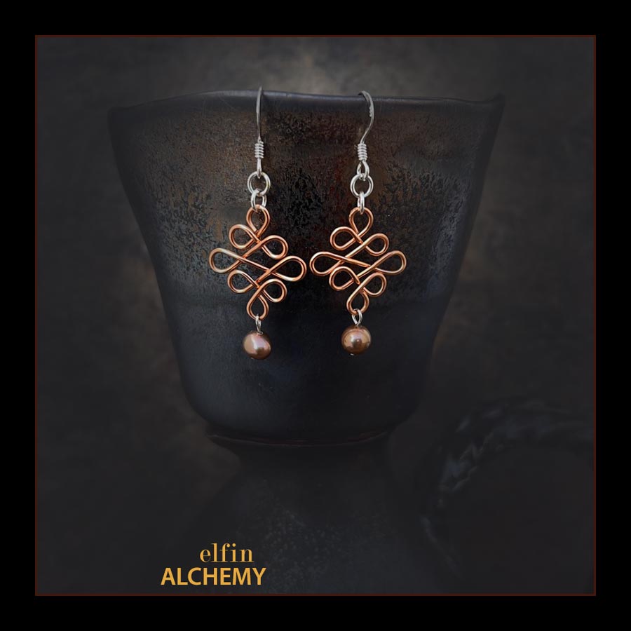 elfin alchemy copper colour sculptural Celtic style freshwater pearl earrings inspired by the magical art of our ancient ancestors, handmade in Lancashire, England