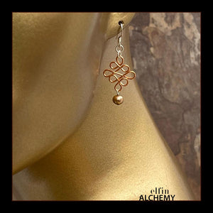 elfin alchemy copper sculptural Celtic style freshwater pearl earrings inspired by the magical art of our ancient ancestors, handmade in Lancashire, England