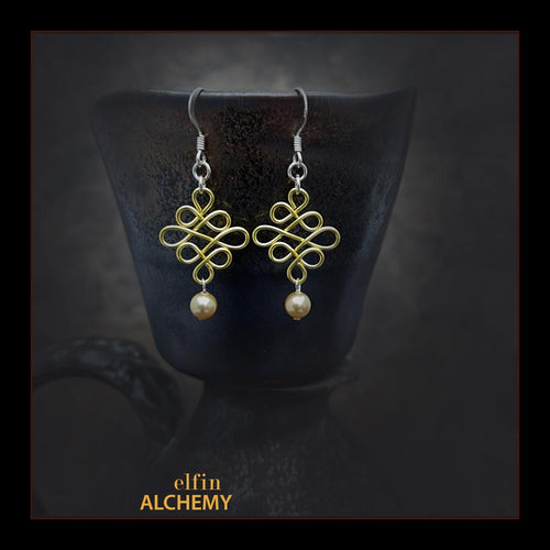elfin alchemy gold colour sculptural Celtic style Swarovski pearl earrings inspired by the magical art of our ancient ancestors, handmade in Lancashire, England