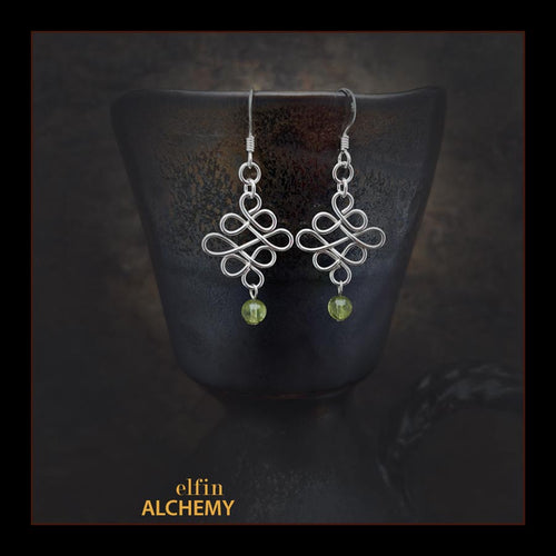 elfin alchemy sterling silver sculptural Celtic style peridot gemstone earrings inspired by the magical art of our ancient ancestors, handmade in Lancashire, England