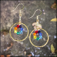 Load image into Gallery viewer, elfin alchemy gold colour sculptural hoop design rainbow colour Swarovski earrings with stunning sparkles, handmade in Lancashire, England
