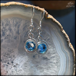 elfin alchemy stunning sculptural spiral sterling silver earrings with aquamarine Swarovski crystals, a design inspired by the magical art of our ancient ancestors
