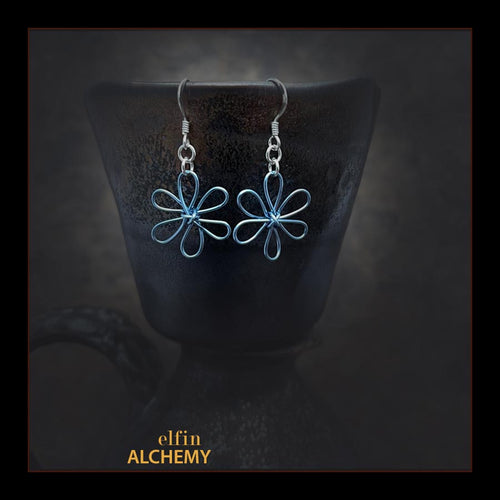 elfin alchemy pale blue sculptural flower style earrings inspired by the magical art of our ancient ancestors, handmade in Lancashire, England