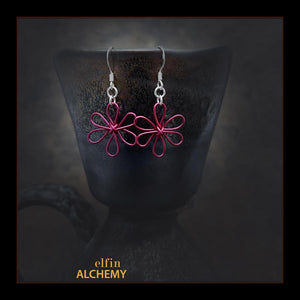 elfin alchemy magenta pink sculptural flower style earrings inspired by the magical art of our ancient ancestors, handmade in Lancashire, England