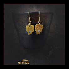Load image into Gallery viewer, elfin alchemy gold colour leaf charm earrings with Swarovski crystals and plated ear hooks handmade in Lancashire, England

