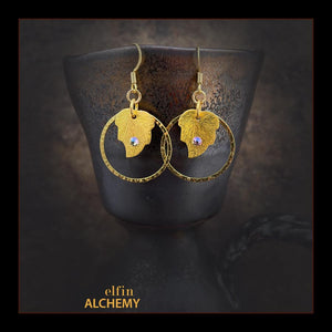 elfin alchemy gold colour leaf charm earrings with Swarovski crystals and hammered hoops with plated metal ear hooks, handmade in Lancashire, England