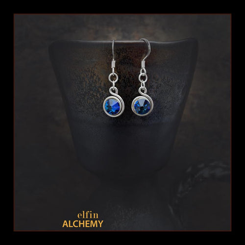 elfin alchemy stunning sculptural spiral sterling silver earrings with blue-purple Swarovski crystals, a design inspired by the magical art of our ancient ancestors