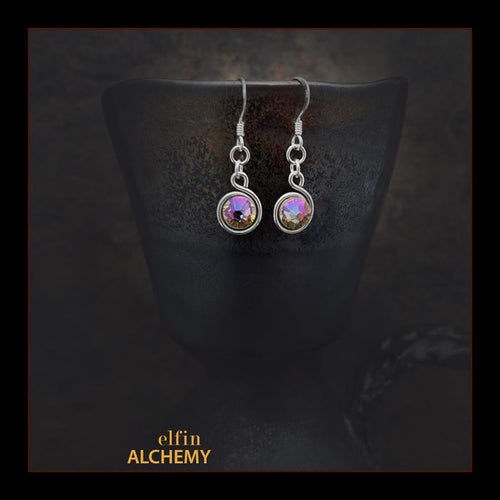 elfin alchemy stunning sculptural spiral sterling silver earrings with light golden Swarovski crystals, a design inspired by the magical art of our ancient ancestors