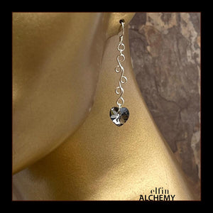 elfin alchemy sterling silver sculptural vine scroll earrings with grey-black front and green back colour Swarovski crystal hearts, inspired by the magical art of our ancient ancestors, handmade in Lancashire, England