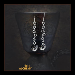 elfin alchemy sterling silver sculptural vine scroll earrings with grey-black front and green back colour Swarovski crystal hearts, inspired by the magical art of our ancient ancestors, handmade in Lancashire, England