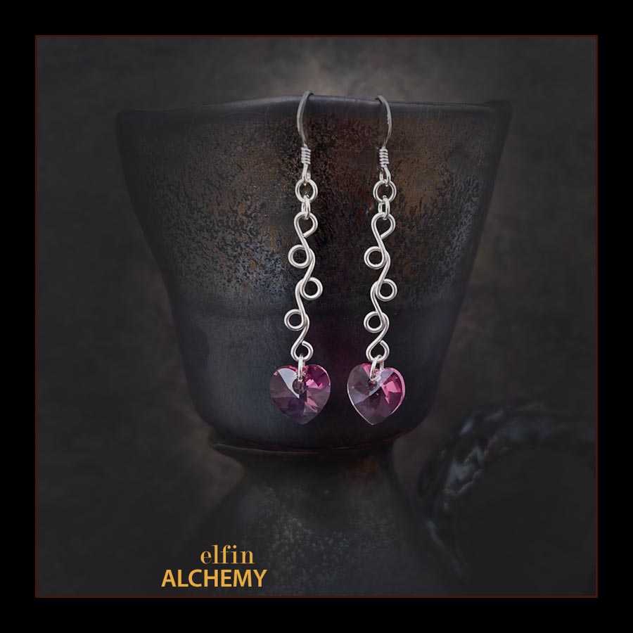 elfin alchemy sterling silver sculptural vine scroll pink Swarovski heart earrings inspired by the magical art of our ancient ancestors, handmade in Lancashire, England